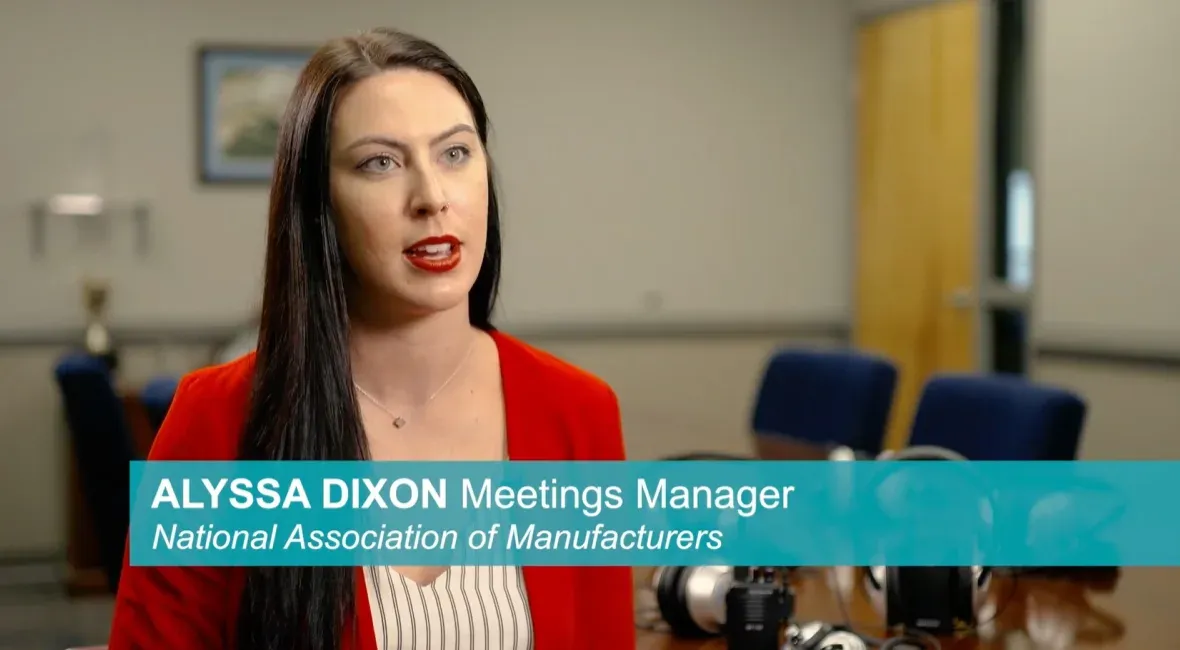 Alyssa Dixon, Meetings Manager at the National Association of Manufacturers, with Plant-Tours.com headphones on the table